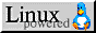 A button with linux powered written on it and tux